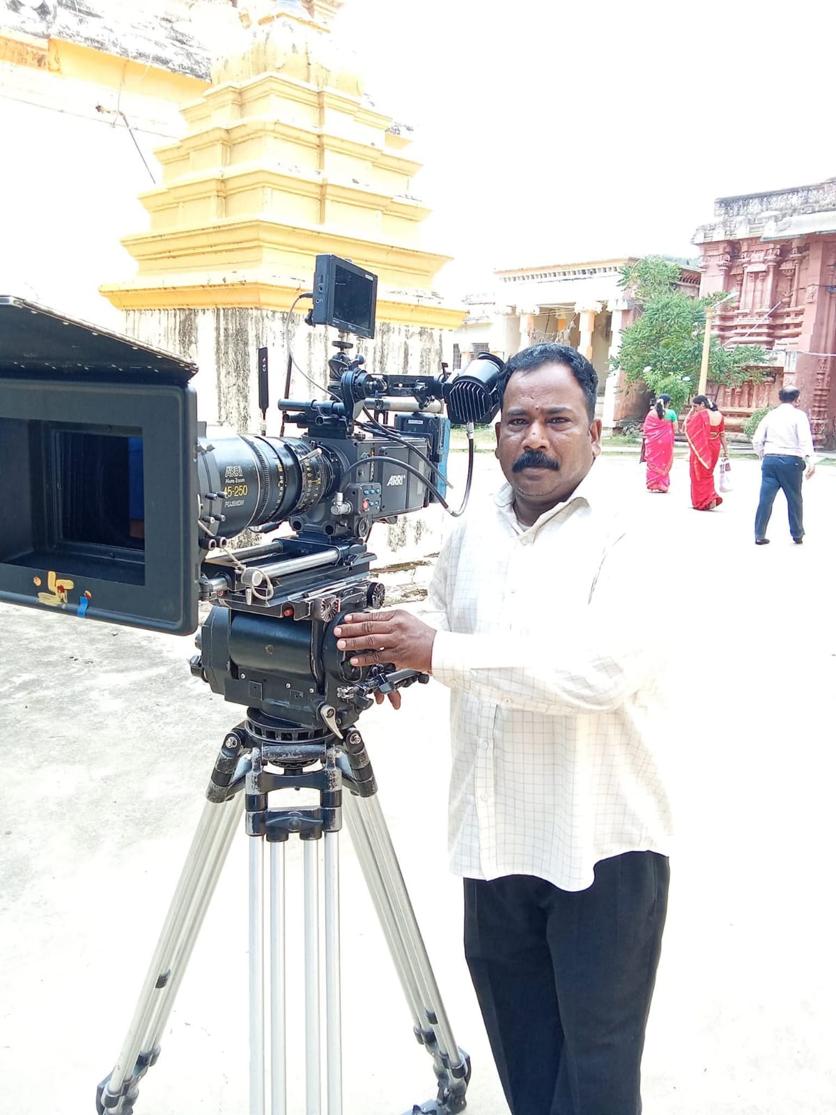 Arun Prabhakar standing with a professional cinema camera